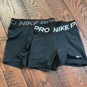 Lot of 2 Nike Pros XS. Black/gray and black/ white. Excellent used condition.